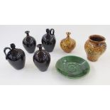 Group of British studio pottery, mostly by Russell Akerman, comprising: two earthenware bottle vases