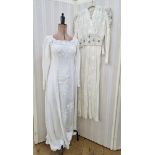A 1930's bias cut white evening gown, the bodice embroidered with black and white thread and small