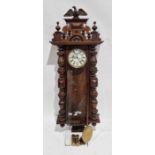 19th-century walnut-cased Vienna regulator-style wall clock, case with eagle cresting, the glazed