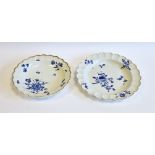 Two Worcester dry-blue scalloped plates, circa 1770, one probably decorated in the workshop of James