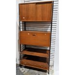 V Mid-century Staples Ladderax modular teak wall unit, comprising a cupboard with sliding doors