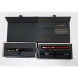 V Two boxed Parker Sonnet converted filled fountain pens, one with black lacquered case and the