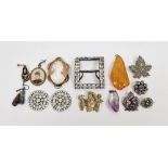 Diamante set buckle and marcasite leaf brooch, a gilt brooch of three children, two diamante set