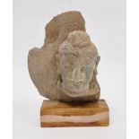 Carved stone Bodhisattva head fragment, possibly Gandhara region & 4th Century, the hair with