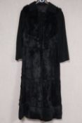 A vintage full length fur coat. Size L.130cm Inside arm length 37cm.