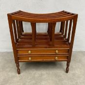 A 19th century style mahogany Canterbury magazine rack with five openwork recesses over two frieze
