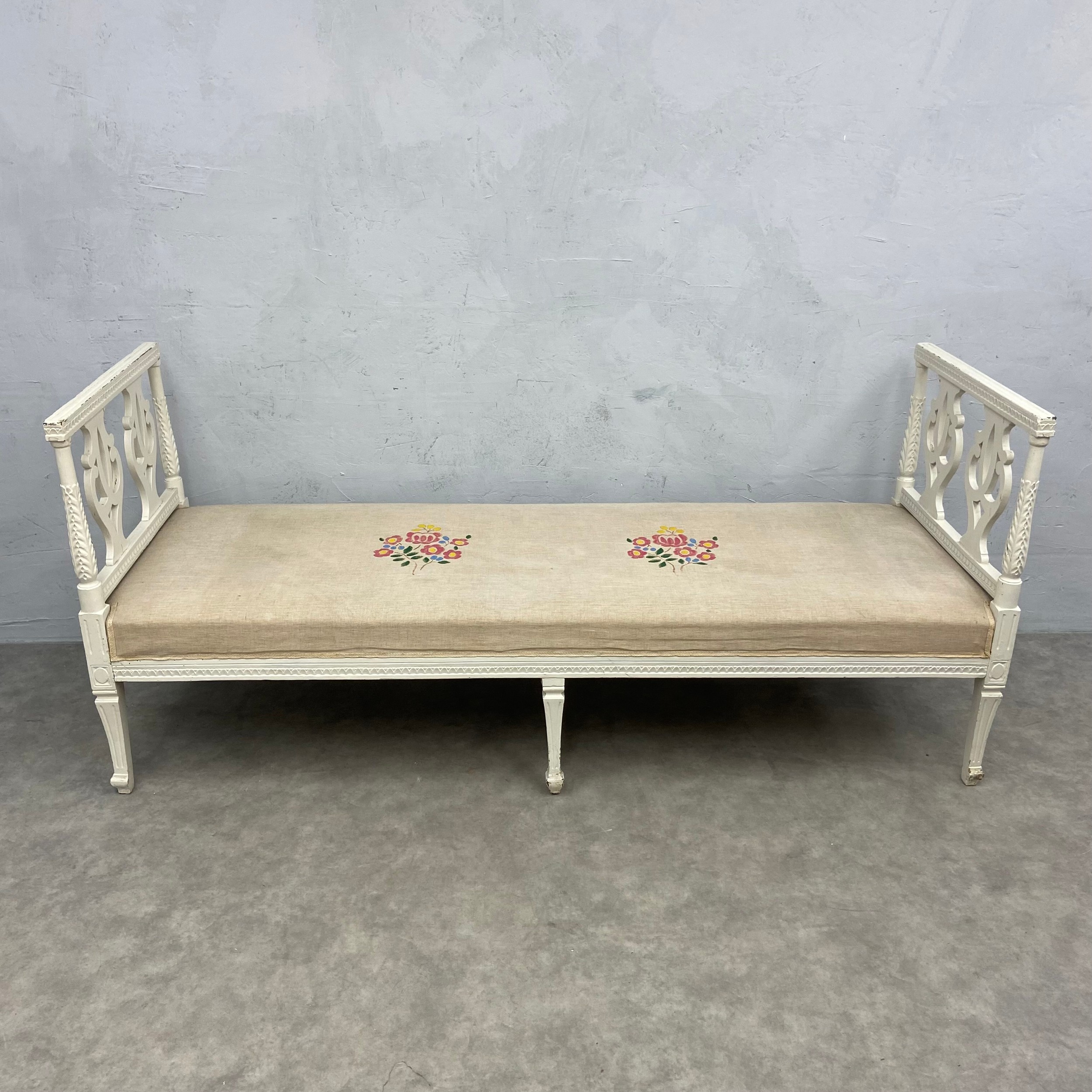 A 19th century Gustavian window seat or day bed with needlework upholstered seat raised on a painted - Image 2 of 6