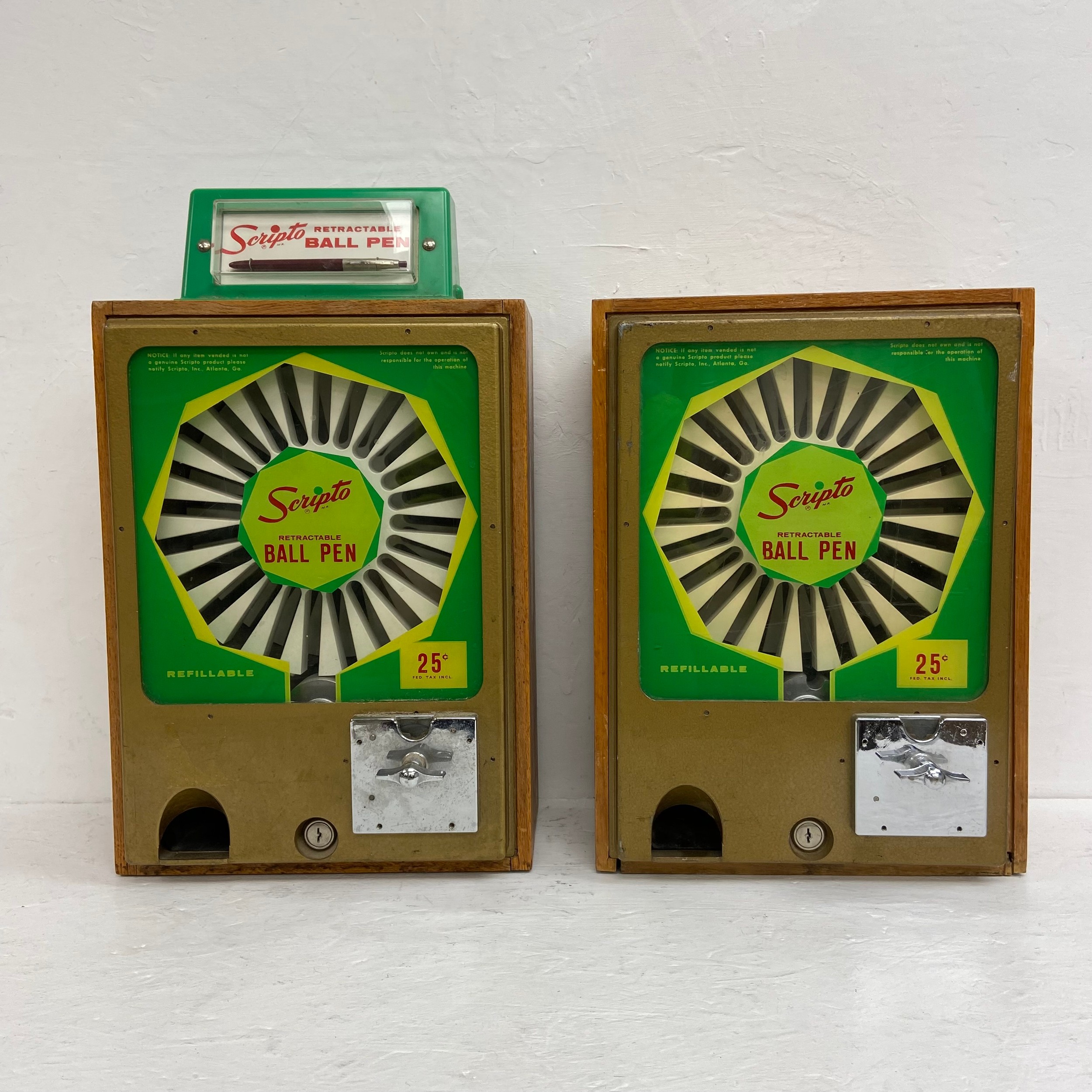 A pair of vintage Scripto Retractable Ball Pen vending machines. H.51 W.32cm. (Largest)