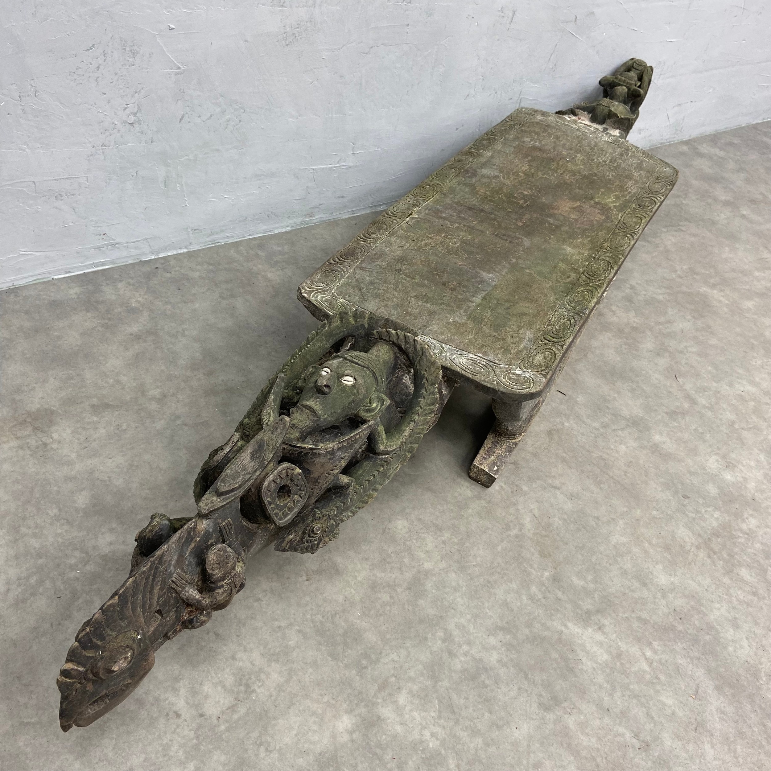 A 20th century African tribal hardwood ceremonial bench of abstract figural form with carved - Image 5 of 7