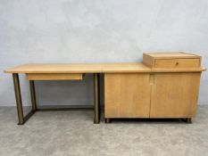 A vintage limed oak modular desk in two parts having a rectangular top with superstructural and