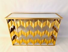 A contemporary console or side table in the Hollywood Regency style having a mirrored top raised