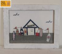 A framed and glazed woolwork and textile collage: Surf Shack. 48x38cm.