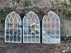 A set of three Ecclesiastical style arched mirrors in painted metal frames. 80x42cm.