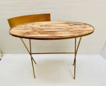 A campaign style writing table with gilt metal frame and recycled timber surface. 90 x 100 x 45cm