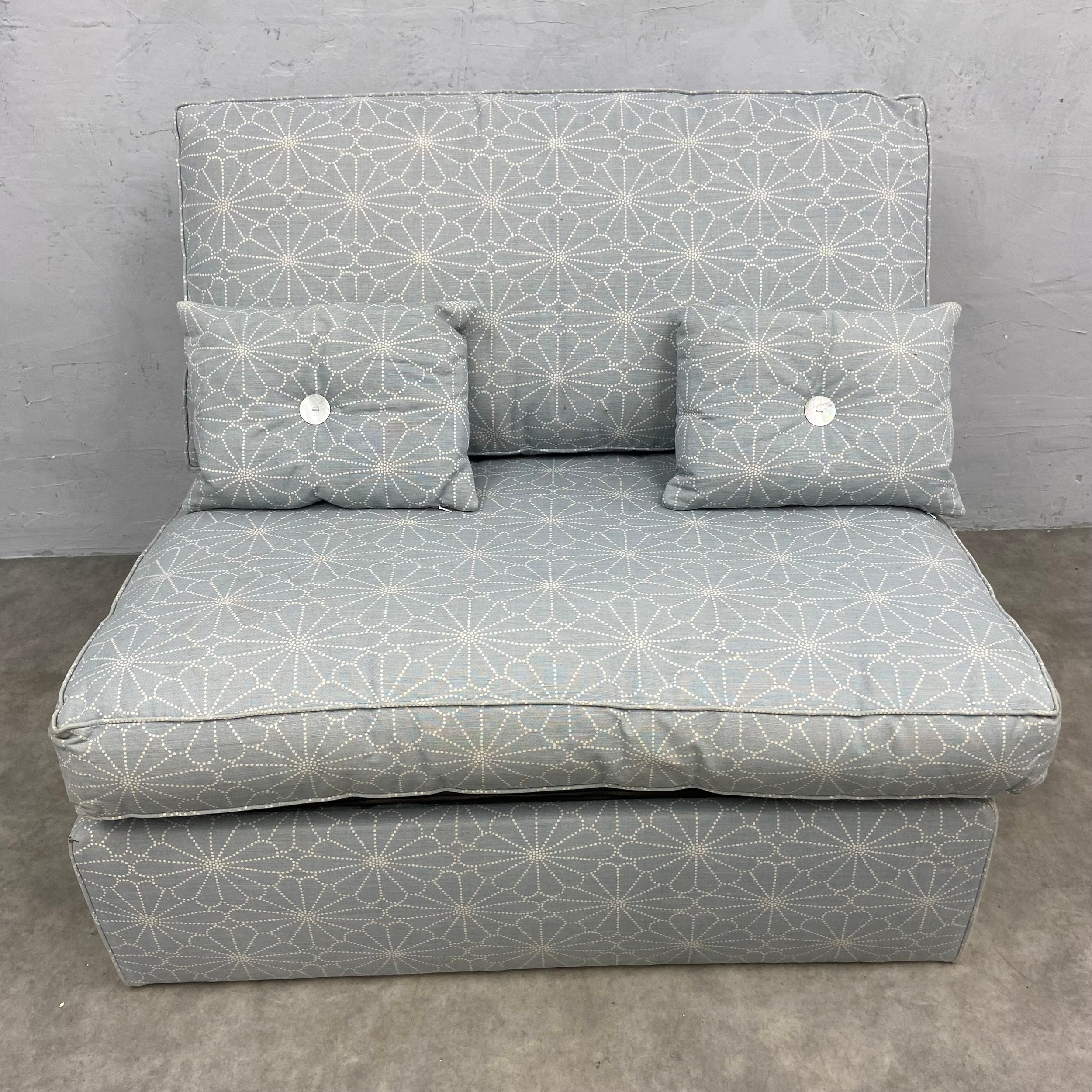 A contemporary single sofa bed with pale blue patterned upholstery. H.85 W.103 D.92cm. Mattress. L.