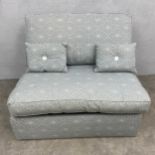 A contemporary single sofa bed with pale blue patterned upholstery. H.85 W.103 D.92cm. Mattress. L.