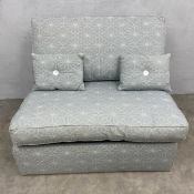 A contemporary single sofa bed with pale blue patterned upholstery. H.85 W.103 D.92cm. Mattress. L.