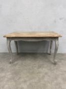 A C.1900 Louis XV style coffee table with quatrefoil parquet top raised on silver painted acanthus