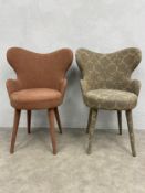 Two contemporary fabric upholstered side or accent armchairs each with shaped back and arms over the
