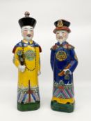 Two 20th century Chinese hand painted Sancai style porcelain figures depicting Qing Emperors or