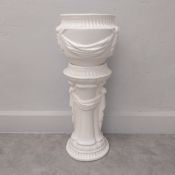 A vintage white glazed ceramic jardiniere in two parts with Neoclassical style garland decoration.