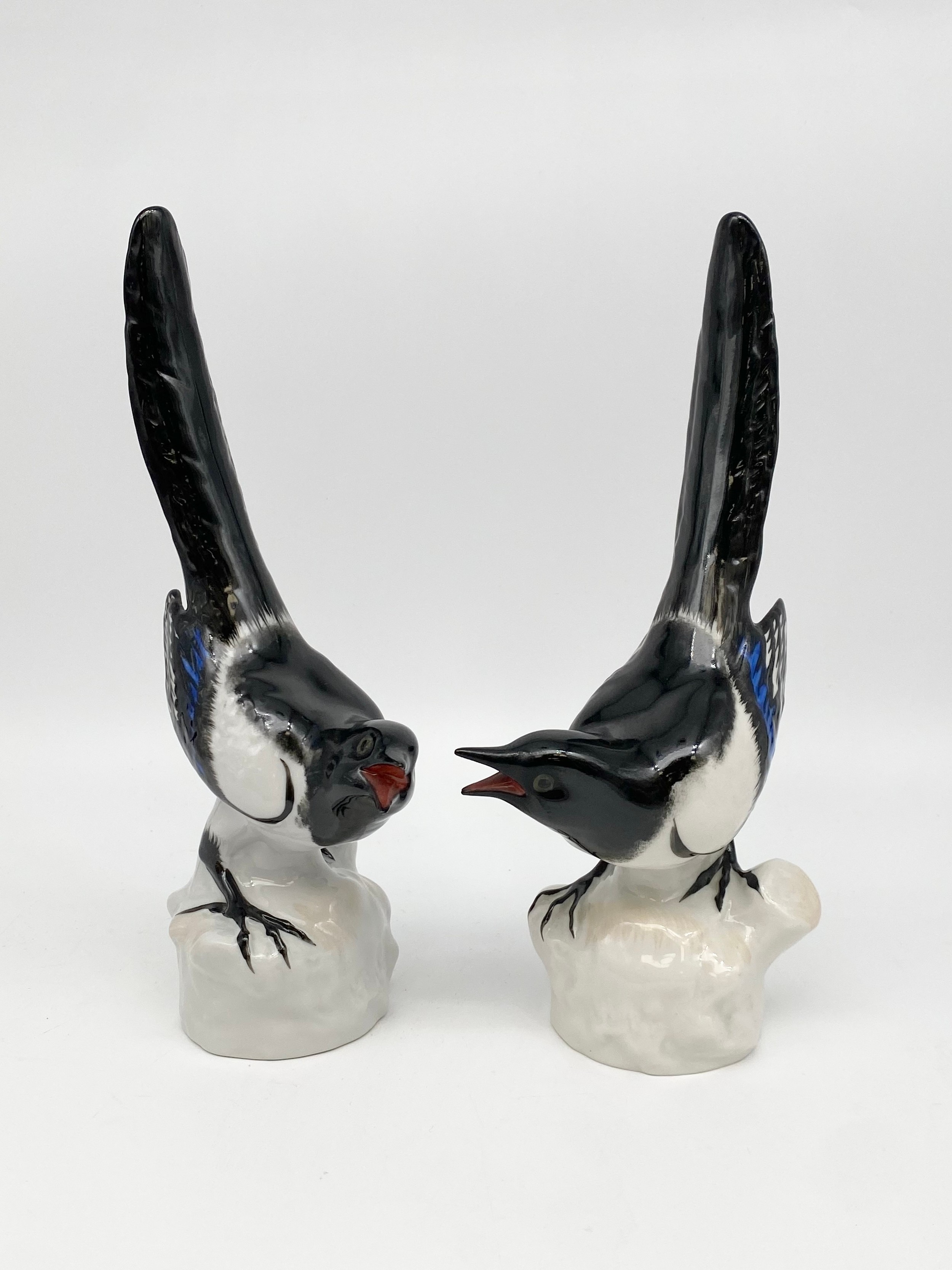 A pair of vintage Russian USSR Lomonosov porcelain magpies with maker's marks. H.26cm each