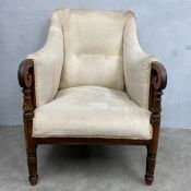 A 19th century mahogany framed library armchair with square back and shaped arms over the cream