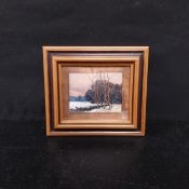 A contemporary oil on copper panel depicting a wintry rural landscape in a hammered copper border.