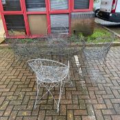 A suite of Victorian painted wirework garden furniture, viz: A circular table and the four