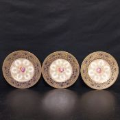 A set of three early 20th century hand painted and gilt cobalt cabinet plates by Jack Stanley for