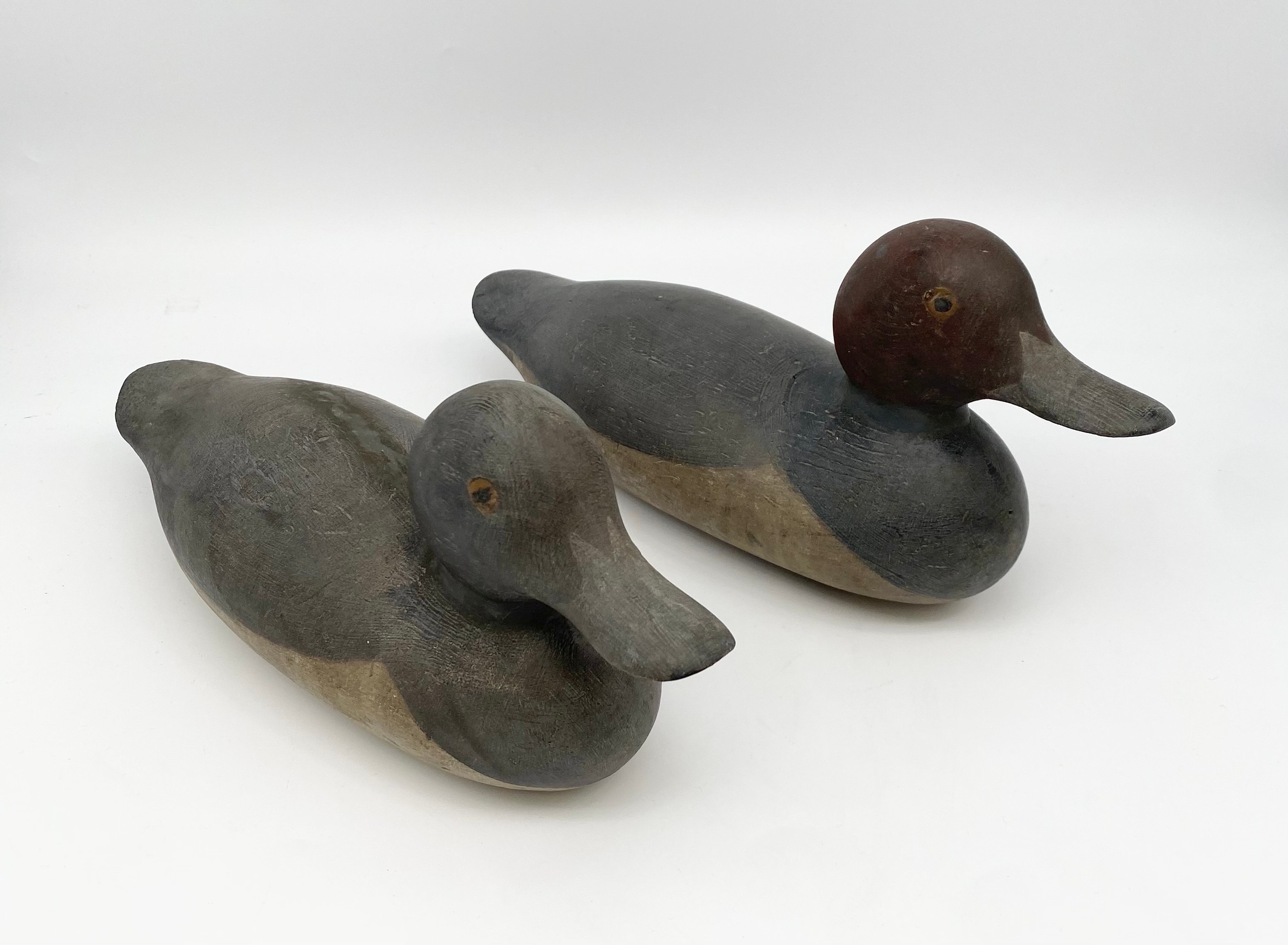 A pair of vintage hand carved and painted decoy ducks. L.35cm each