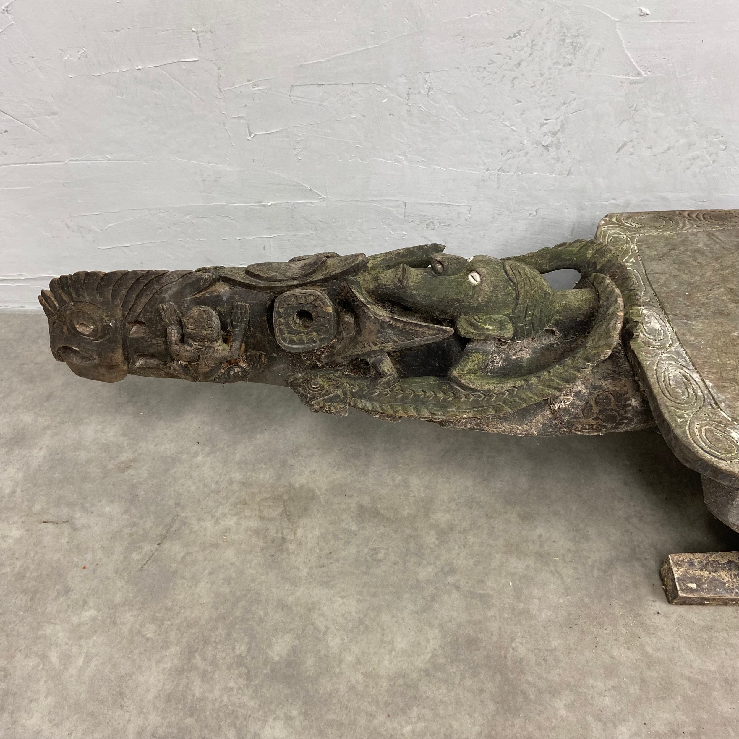 A 20th century African tribal hardwood ceremonial bench of abstract figural form with carved - Image 2 of 7