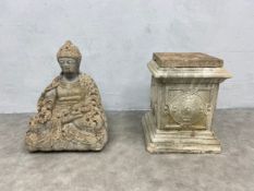 A weathered composite stone statue of the seated Buddha along with a moulded concrete plinth. H.