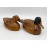 A pair of vintage hand carved ash decoy ducks. L.26cm each