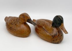 A pair of vintage hand carved ash decoy ducks. L.26cm each
