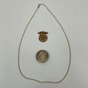 A hallmarked 9ct gold necklace chain together with a 1920s yellow metal pendant brooch and a