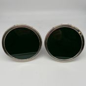 A pair of 1970s 925 sterling silver hallmarked picture frames by Sanders & Mackenzie. Diam.16cm.