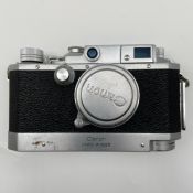 A 1950s vintage Japanese metal cased bottom-loading Canon Camera Company Inc. series IV Rapid Winder