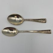 Two 925 sterling silver hallmarked teaspoons by Cartier with impressed maker's marks. L.13cm. (