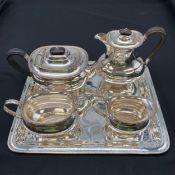 A Henry Atkin & Co. silver plated tea set with tea and coffee pots, creamer and sugar pot together