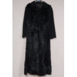 A vintage full length fur coat. Size L.130cm Inside arm length 37cm.