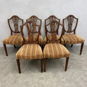 A set of six 19th century mahogany Hepplewhite style shield-back dining chairs each with openwork
