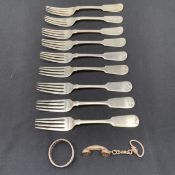 A set of nine hallmarked Continental silver fiddle pattern forks together with a white metal