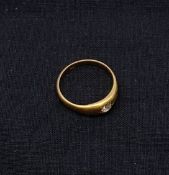 An early 20th century 18ct hallmarked yellow gold gypsy ring with 0.19 carat round cut diamond.