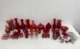 An extensive collection of 19th century and vintage ruby and cranberry glass items to include vases,