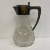 A large 20th century 800 silver mounted cut crystal claret jug. H.34cm.