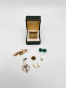 A mixed lot of yellow metal to include a large step cut smoky quartz brooch together with a bar