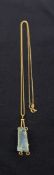 A vintage Italian hallmarked 18ct gold necklace with large rough-cut aquamarine pendant. Gross