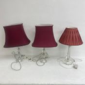A pair of vintage cut glass table lamps with shades together with a similar example. H.57cm. (