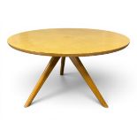 A mid-century beech tripod coffee table with a circular top on flat splayed supports by Victor